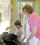 Mardi helps kid cooks at camp